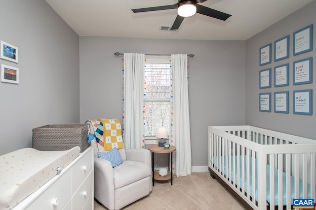 814 Cole St, Charlottesville, VA 22901 - bedroom featuring light colored carpet, a crib, and a ceiling fan