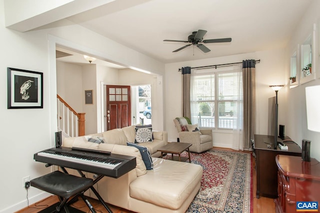 814 Cole St, Charlottesville, VA 22901 - living room featuring wood finished floors, ceiling fan, stairway, and baseboards