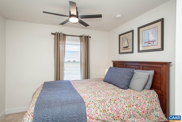 814 Cole St, Charlottesville, VA 22901 - bedroom with light colored carpet, baseboards, and a ceiling fan