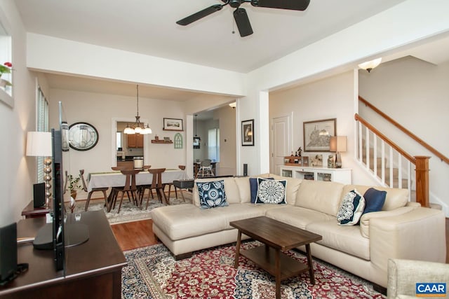 814 Cole St, Charlottesville, VA 22901 - living room with a ceiling fan, wood finished floors, a chandelier, and stairs