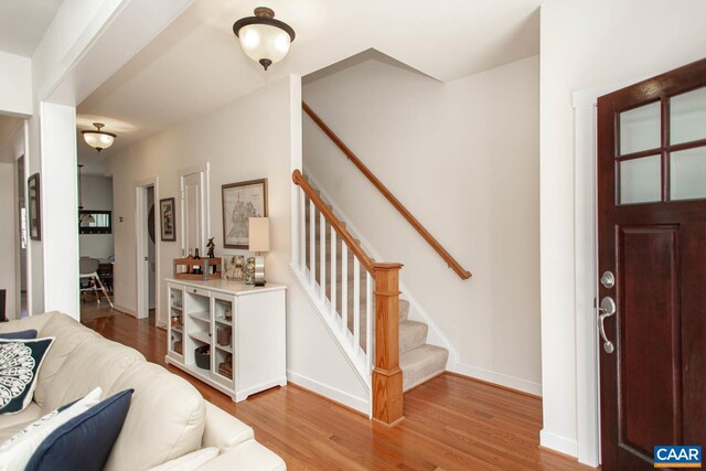 814 Cole St, Charlottesville, VA 22901 - foyer entrance featuring wood finished floors, stairs, and baseboards