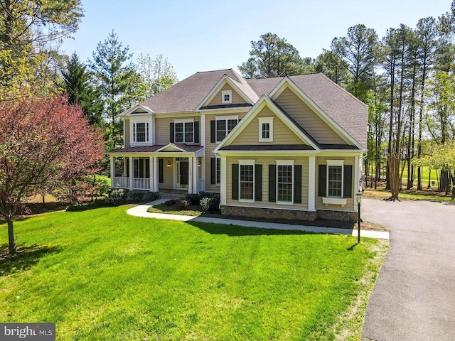 11402 Chivalry Chase Ln, Spotsylvania, VA 22551 - view of front of property featuring a porch, a front lawn, and roof with shingles