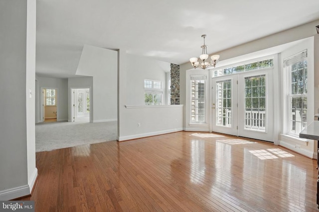 11402 Chivalry Chase Ln, Spotsylvania, VA 22551 - unfurnished dining area with a chandelier, hardwood / wood-style flooring, and baseboards
