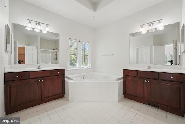 11402 Chivalry Chase Ln, Spotsylvania, VA 22551 - full bathroom with a shower stall, a garden tub, tile patterned flooring, and two vanities