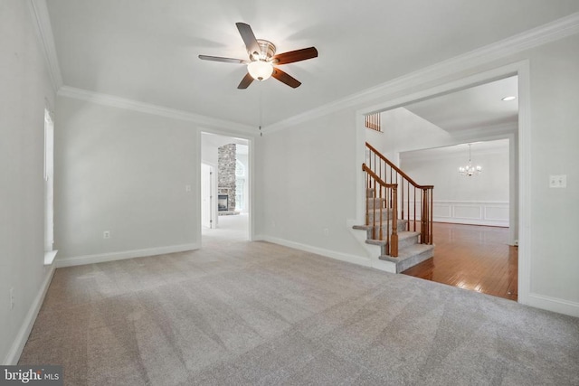 11402 Chivalry Chase Ln, Spotsylvania, VA 22551 - carpeted spare room with a ceiling fan, stairway, crown molding, a chandelier, and baseboards