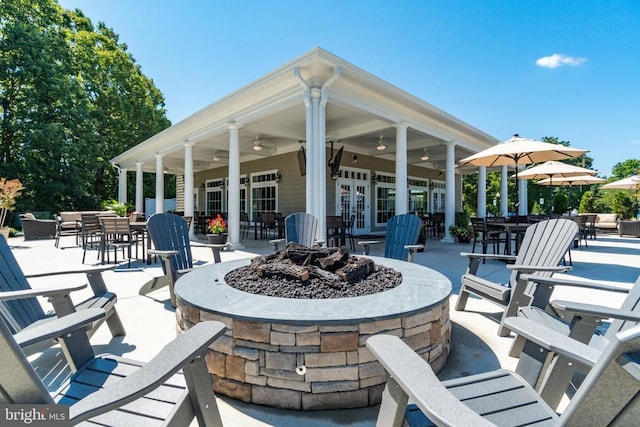 11402 Chivalry Chase Ln, Spotsylvania, VA 22551 - view of patio featuring french doors, a ceiling fan, an outdoor living space with a fire pit, and outdoor dining area