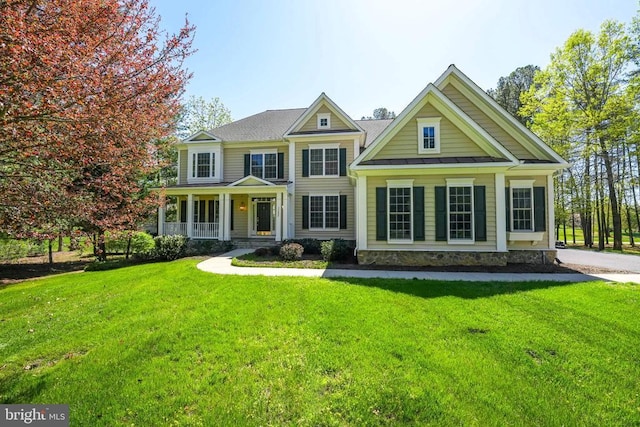 11402 Chivalry Chase Ln, Spotsylvania, VA 22551 - view of front of house with covered porch, a standing seam roof, a front lawn, and metal roof