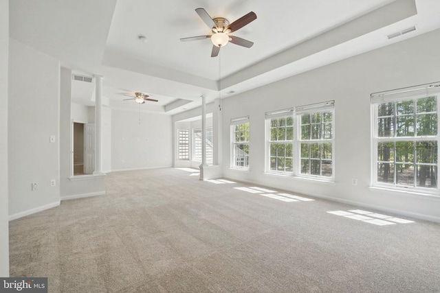 11402 Chivalry Chase Ln, Spotsylvania, VA 22551 - unfurnished living room featuring a ceiling fan, a tray ceiling, carpet floors, and baseboards