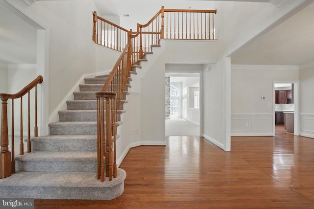 11402 Chivalry Chase Ln, Spotsylvania, VA 22551 - staircase with wood finished floors, crown molding, and baseboards