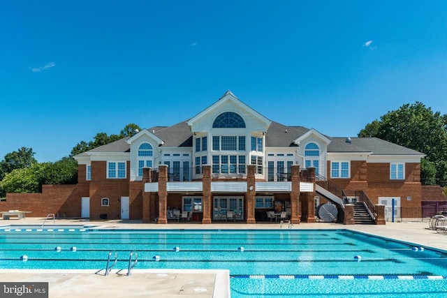 11402 Chivalry Chase Ln, Spotsylvania, VA 22551 - community pool with stairs, a patio, and fence