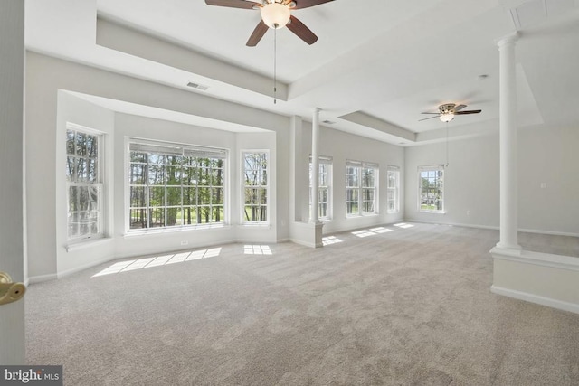 11402 Chivalry Chase Ln, Spotsylvania, VA 22551 - unfurnished living room with ornate columns, a raised ceiling, a ceiling fan, and baseboards
