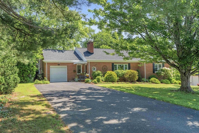 406 College Cir, Staunton, VA 24401 - view of front of property with driveway, a garage, a front yard, brick siding, and a chimney