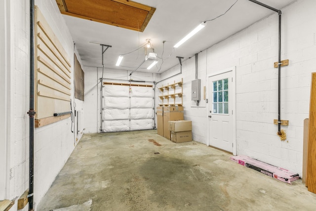 406 College Cir, Staunton, VA 24401 - garage featuring a garage door opener, electric panel, and concrete block wall