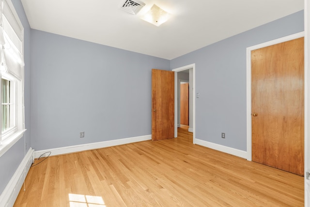406 College Cir, Staunton, VA 24401 - unfurnished bedroom with a baseboard radiator and light wood-style floors