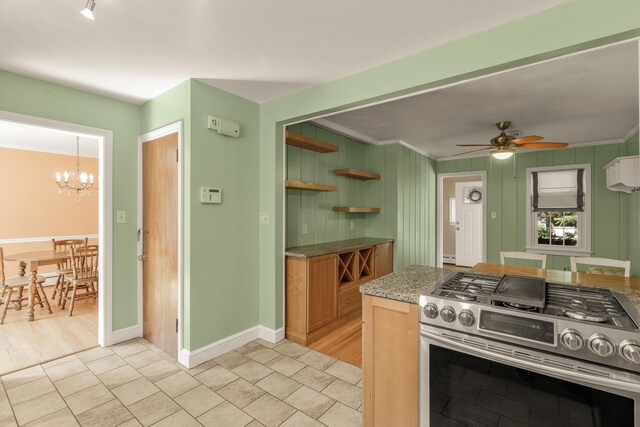 406 College Cir, Staunton, VA 24401 - kitchen featuring stainless steel gas stove, ceiling fan, a chandelier, open shelves, and light stone counters