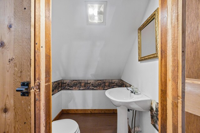 1215 Fort Stover Rd, Luray, VA 22835 - bathroom with wood finished floors and vaulted ceiling