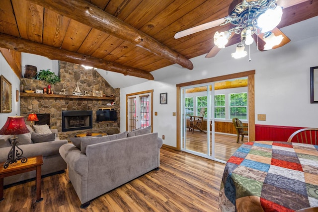 1215 Fort Stover Rd, Luray, VA 22835 - living area featuring wood finished floors, ceiling fan, wood ceiling, wainscoting, and a stone fireplace