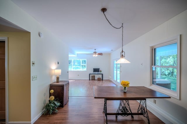 hall with wood finished floors and baseboards
