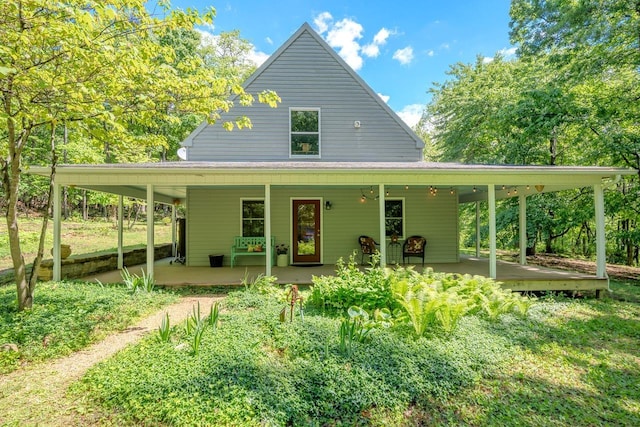 back of house featuring a porch