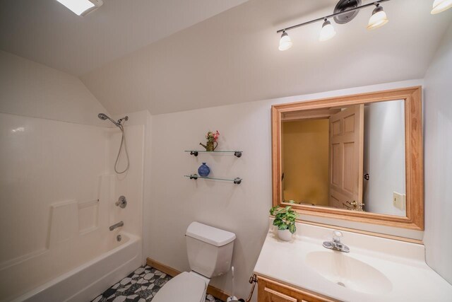 bathroom with toilet, vanity, shower / tub combination, and lofted ceiling