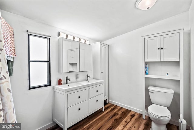 197 Holly Grove Ct, Bumpass, VA 23024 - full bath with wood finished floors, plenty of natural light, toilet, and baseboards