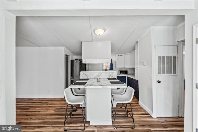 197 Holly Grove Ct, Bumpass, VA 23024 - dining room with wood finished floors and baseboards