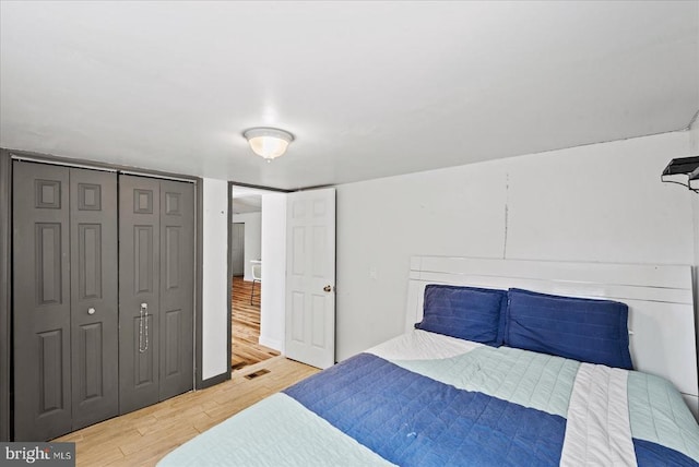 197 Holly Grove Ct, Bumpass, VA 23024 - bedroom featuring wood finished floors and a closet