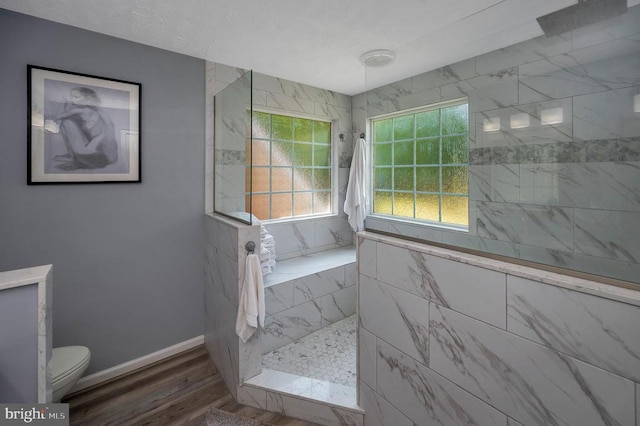 35326 Gosling Ln, Locust Grove, VA 22508 - bathroom featuring toilet, a walk in shower, wood finished floors, and baseboards