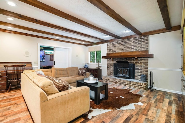 115 Pheasant Rd, Mcgaheysville, VA 22840 - living area featuring light wood finished floors, beam ceiling, recessed lighting, and a fireplace