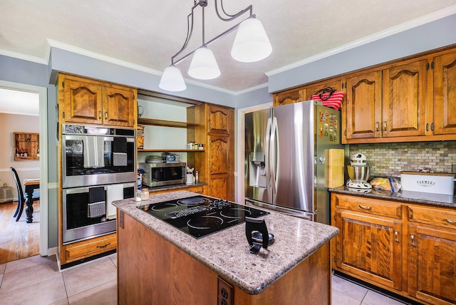 115 Pheasant Rd, Mcgaheysville, VA 22840 - kitchen with appliances with stainless steel finishes, brown cabinets, a kitchen island, tasteful backsplash, and light tile patterned flooring