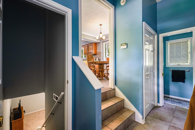 115 Pheasant Rd, Mcgaheysville, VA 22840 - stairs featuring a chandelier, tile patterned floors, and baseboards