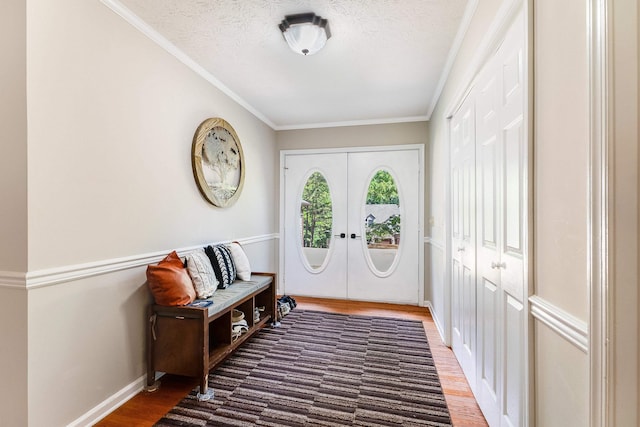 115 Pheasant Rd, Mcgaheysville, VA 22840 - foyer with wood finished floors, french doors, baseboards, crown molding, and a textured ceiling