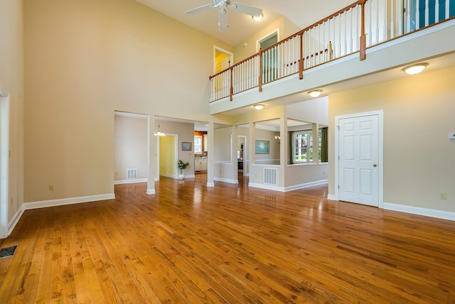 2554 Village Dr, Waynesboro, VA 22980 - unfurnished living room with a high ceiling, a ceiling fan, and wood finished floors