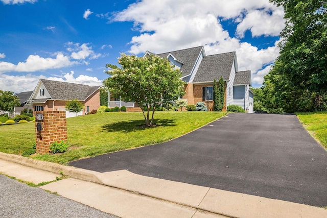 2554 Village Dr, Waynesboro, VA 22980 - view of front of house featuring brick siding, asphalt driveway, and a front yard