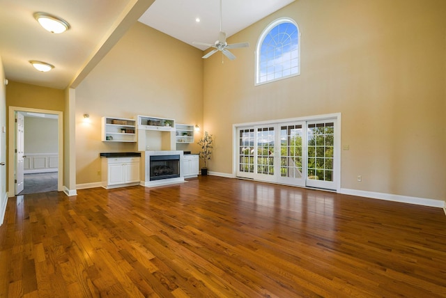 2554 Village Dr, Waynesboro, VA 22980 - unfurnished living room featuring dark wood-style floors, plenty of natural light, high vaulted ceiling, ceiling fan, and a fireplace