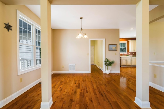 2554 Village Dr, Waynesboro, VA 22980 - unfurnished dining area featuring wood finished floors, recessed lighting, and a chandelier