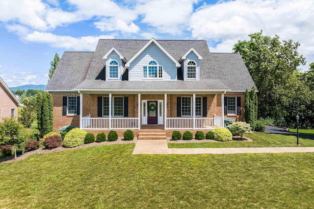 2554 Village Dr, Waynesboro, VA 22980 - cape cod home with brick siding, a front lawn, and a porch
