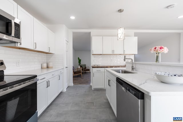 6760 Courthouse Rd, Louisa, VA 23093 - kitchen featuring a sink, white cabinets, appliances with stainless steel finishes, tasteful backsplash, and recessed lighting
