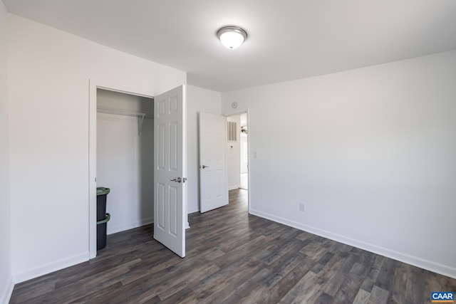 6760 Courthouse Rd, Louisa, VA 23093 - unfurnished bedroom featuring baseboards, dark wood-type flooring, and a closet
