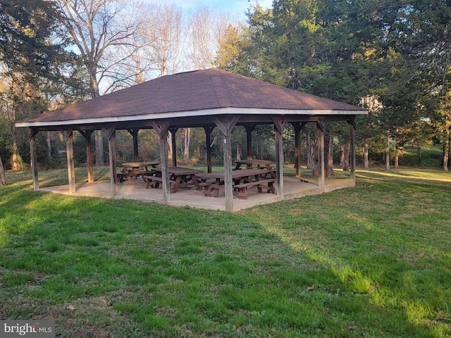 view of home's community with a gazebo, a lawn, and a patio
