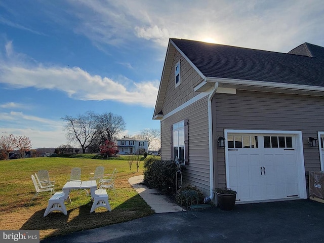 view of side of home featuring a yard