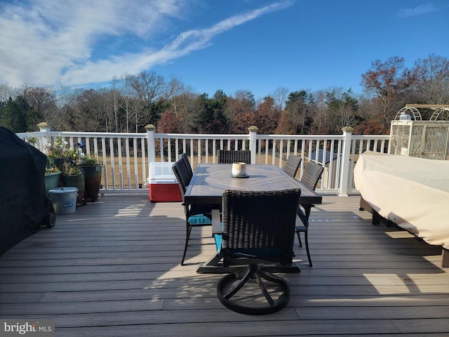 wooden deck featuring outdoor dining space