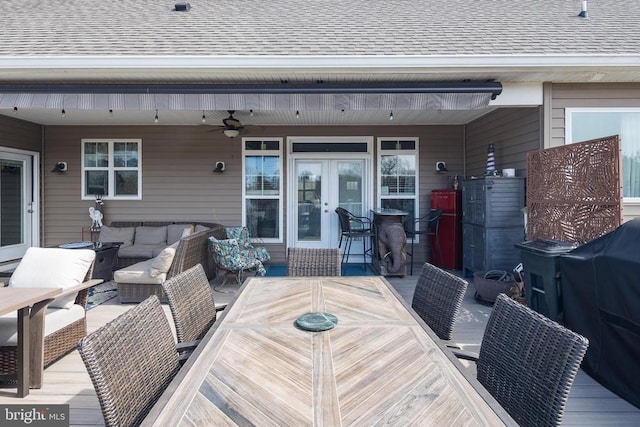 wooden terrace featuring outdoor dining space, outdoor lounge area, ceiling fan, and french doors