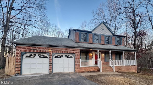 view of front facade with a garage and covered porch