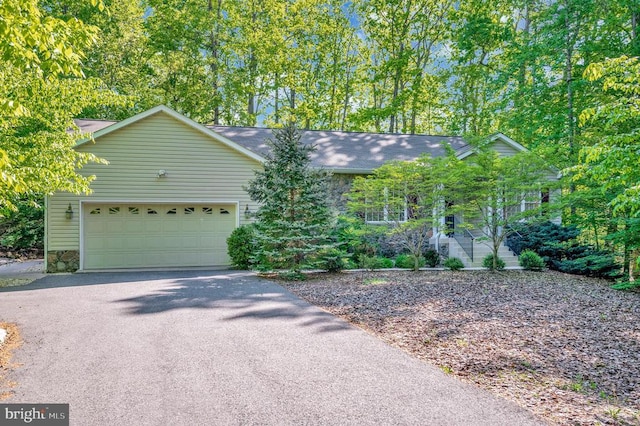 104 Tall Pines Ave, Locust Grove, VA 22508 - single story home with a garage, stone siding, and driveway
