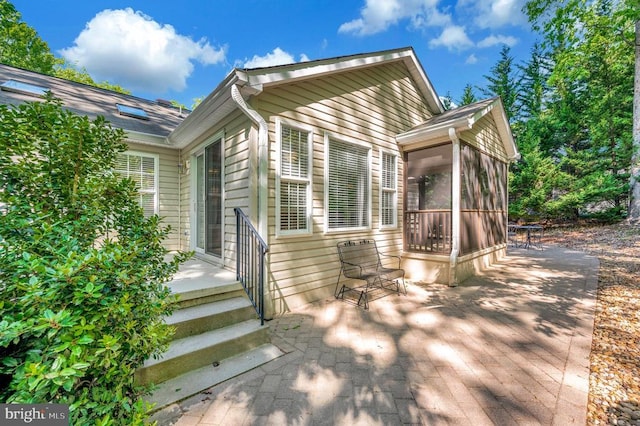 104 Tall Pines Ave, Locust Grove, VA 22508 - exterior space featuring a sunroom and a patio area