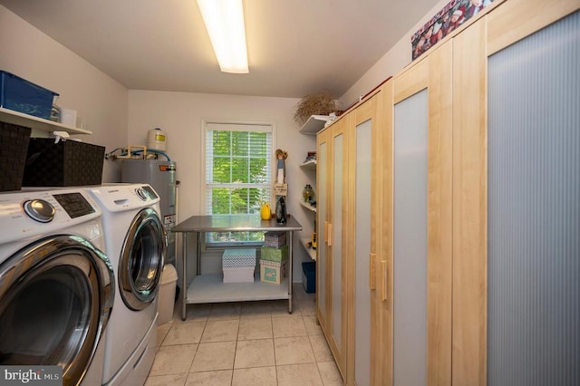 104 Tall Pines Ave, Locust Grove, VA 22508 - laundry area featuring cabinet space, washing machine and clothes dryer, and light tile patterned floors