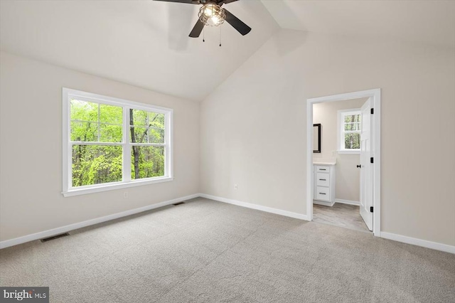 358 Hemlock Ln, Mineral, VA 23117 - unfurnished bedroom with lofted ceiling, carpet flooring, baseboards, connected bathroom, and a ceiling fan