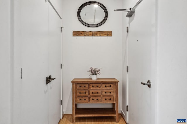 hallway with light wood-style flooring