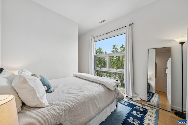 bedroom featuring wood finished floors